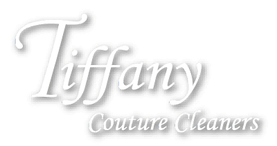 Tiffany Couture Cleaners logo with 'Tiffany' in large cursive font and 'Couture Cleaners' in smaller italics below on a light background.
